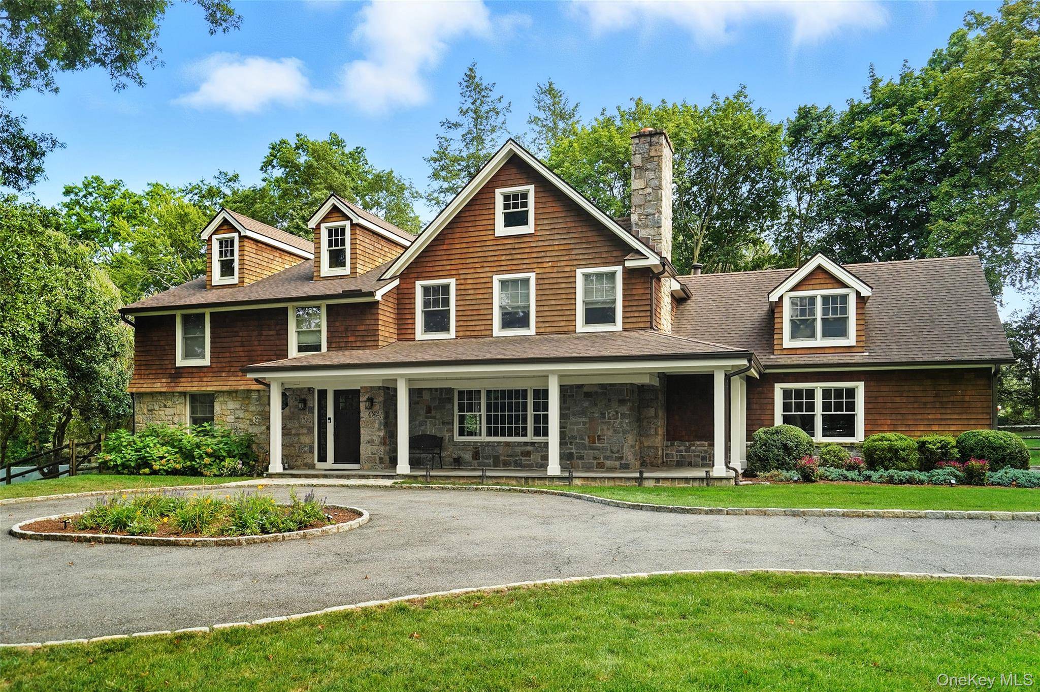 Discover the perfect getaway in this stunning shingle style home, ideally set on 1.