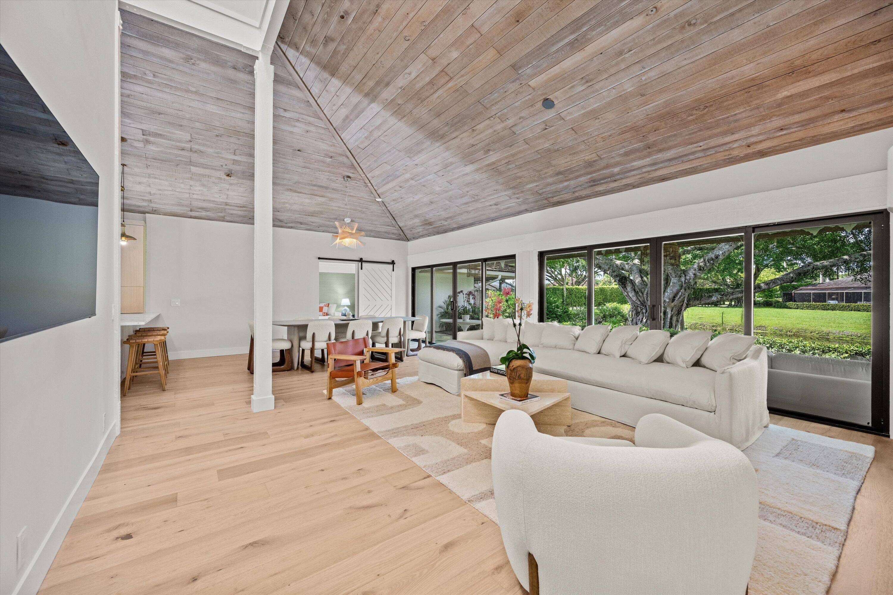 This stunning mid century modern designed bungalow not only offers luxurious interiors but also boasts an enchanting outdoor space with serene water views, providing a tranquil backdrop for outdoor entertaining.