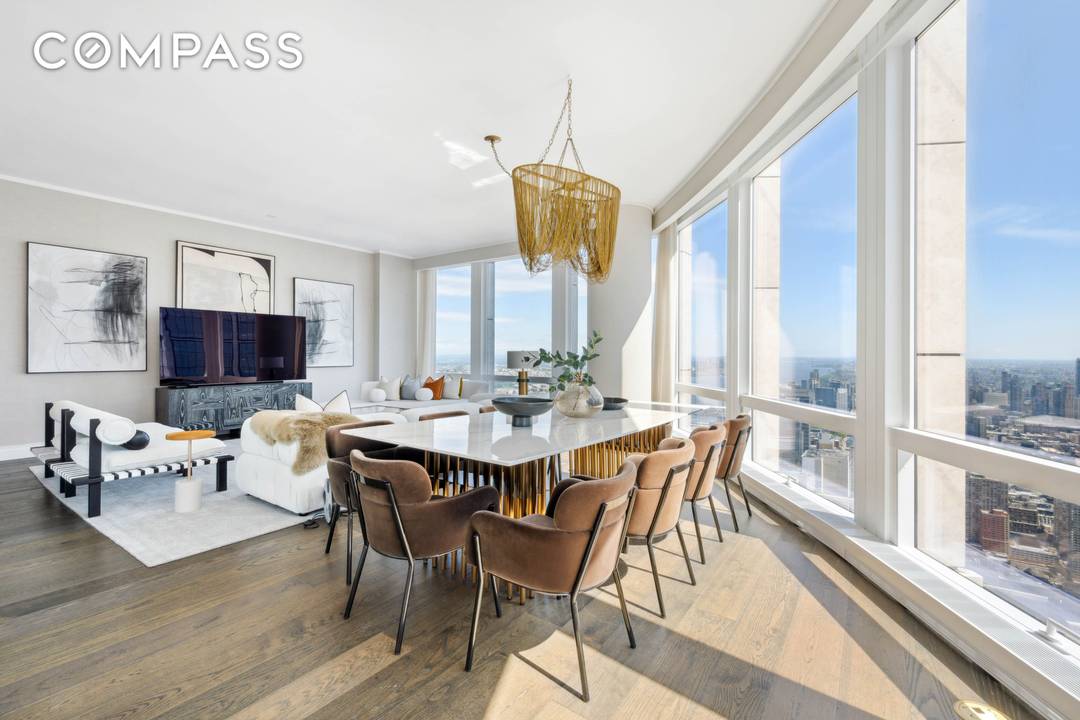 This impeccably designed three bedroom residence showcases nearly 11 foot lofted ceilings and sweeping uptown skyline views from its corner Great Room.