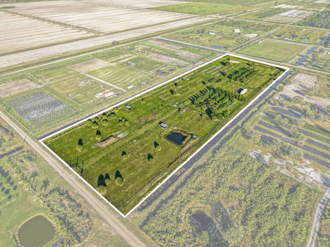Exceptional opportunity to own nearly 9 acres of fully improved agricultural land in Loxahatchee ready for farming, livestock, or to make your private estate.