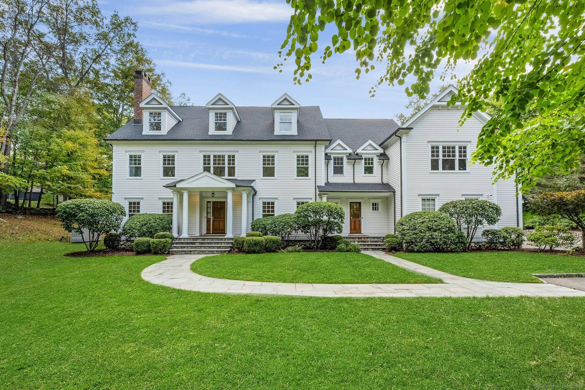 Crafted by noted custom builder Garrett Wilson and meticulously enhanced with recent upgrades, this Greenfield Hill home is as impressive as it is inviting.