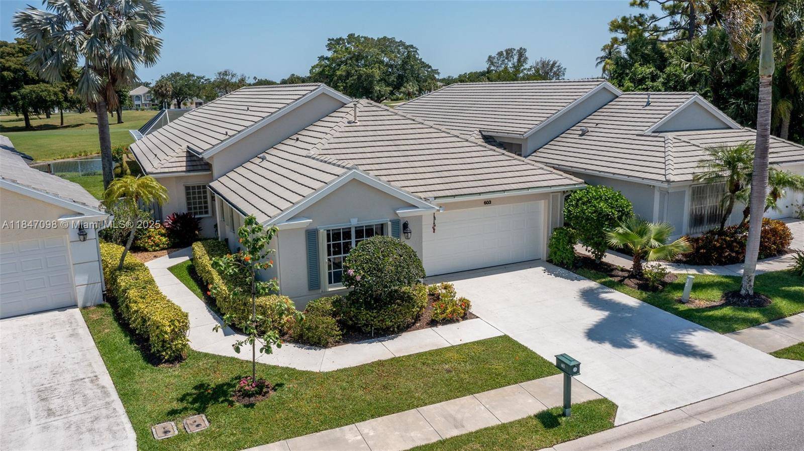 Discover effortless Florida elegance at 603 Masters Way in PGA National's prestigious Eagleton Pointe.