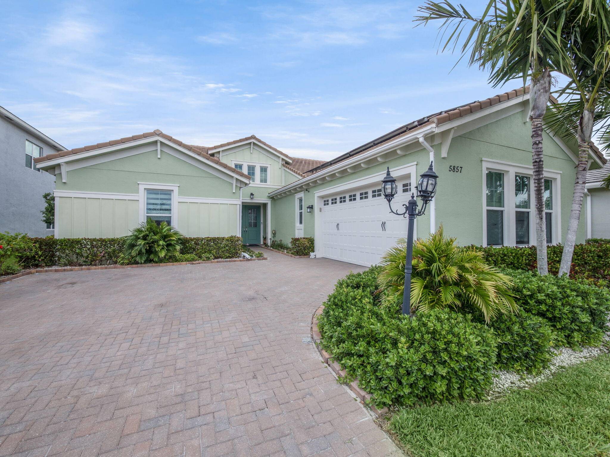 Enjoy paradise this winter in this stunning 2019 3 3 home in one of Westlake's top gated Hammocks communities.