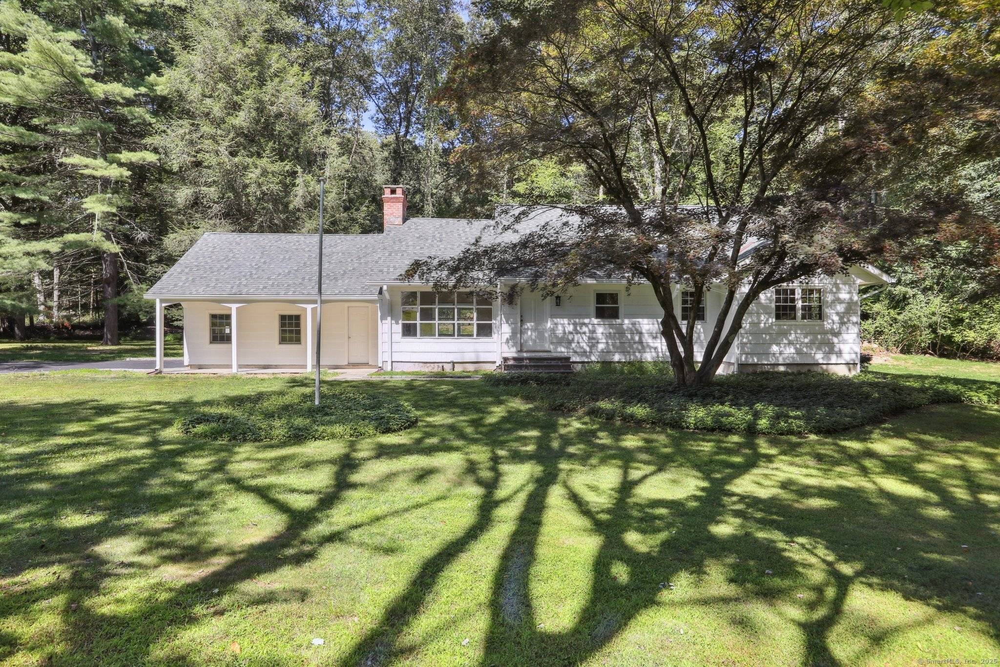 Beautiful Cape Cod style home set on a desirable, tree lined street in a prime location.