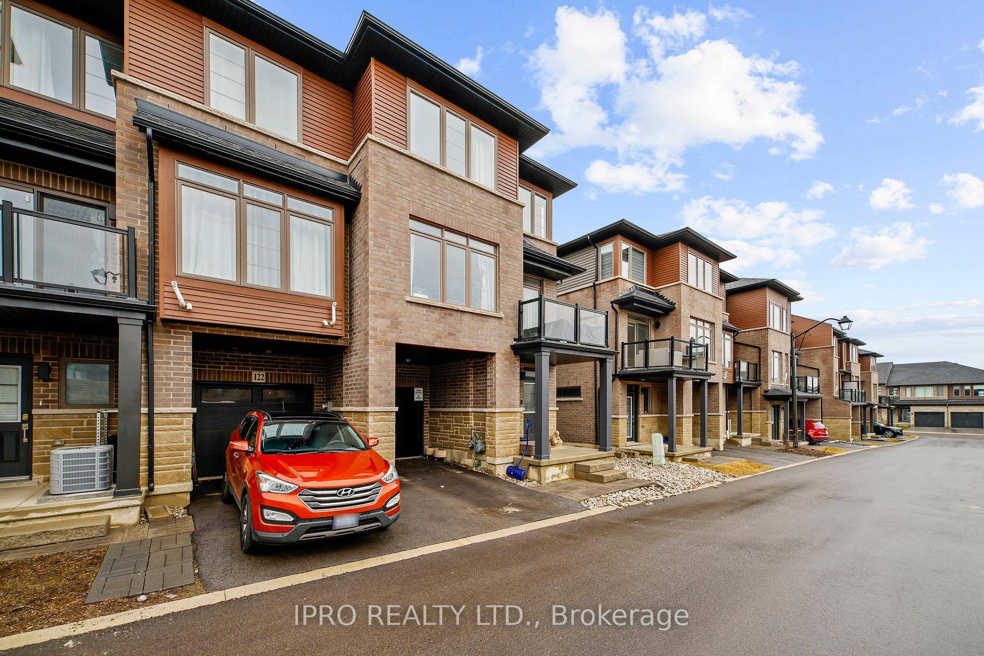 Welcome to 61 Soho Street, Unit 123, a beautifully crafted END UNIT freehold townhouse nestled in the highly desirable Central Park community !