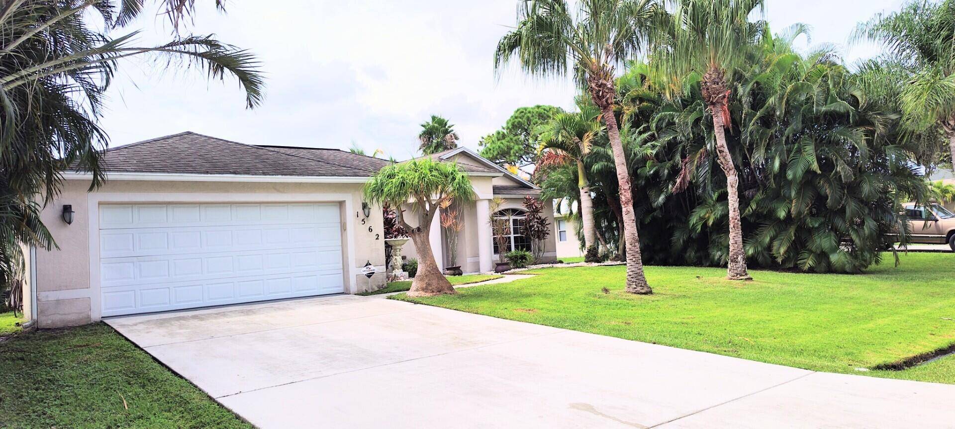 Don't miss Out on this Large 2, 548 SF Under Roof 4 Bedroom, 2 Bath, 2 Car Garage Home with Large Screened in Lanai Under Roof.