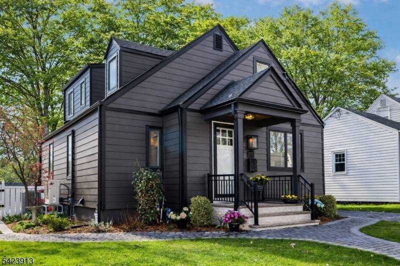 Move right into this beautifully renovated and expanded Metuchen Cape Cod style home, ideally set on a quiet street with park views and a generous backyard designed for entertaining.