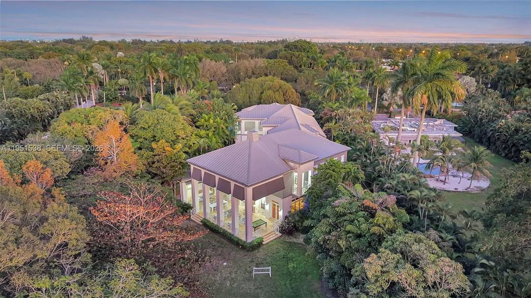 Set on a rare 1. 3 acre estate, this exceptional Plantation residence offers remarkable scale, privacy, and architectural presence.