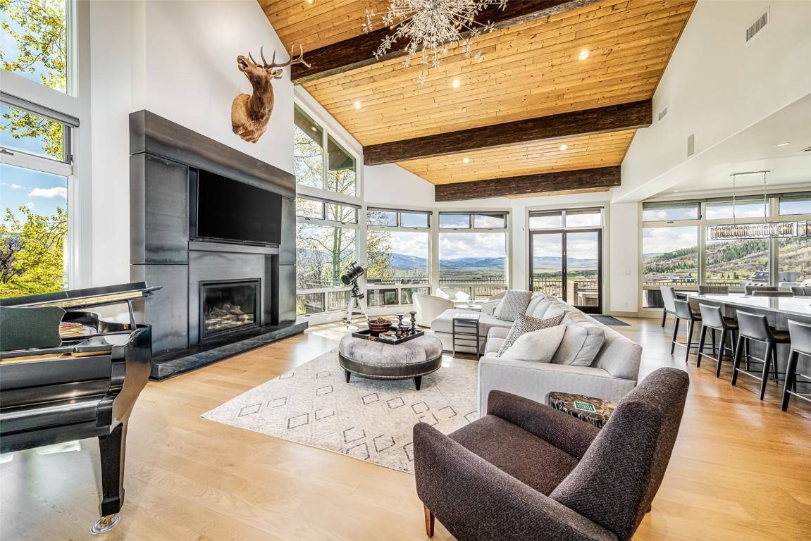 This 5, 806 s. f. home is perched on over four acres in Dakota Ridge, where the floor to ceiling windows reign sweeping views for all to marvel.
