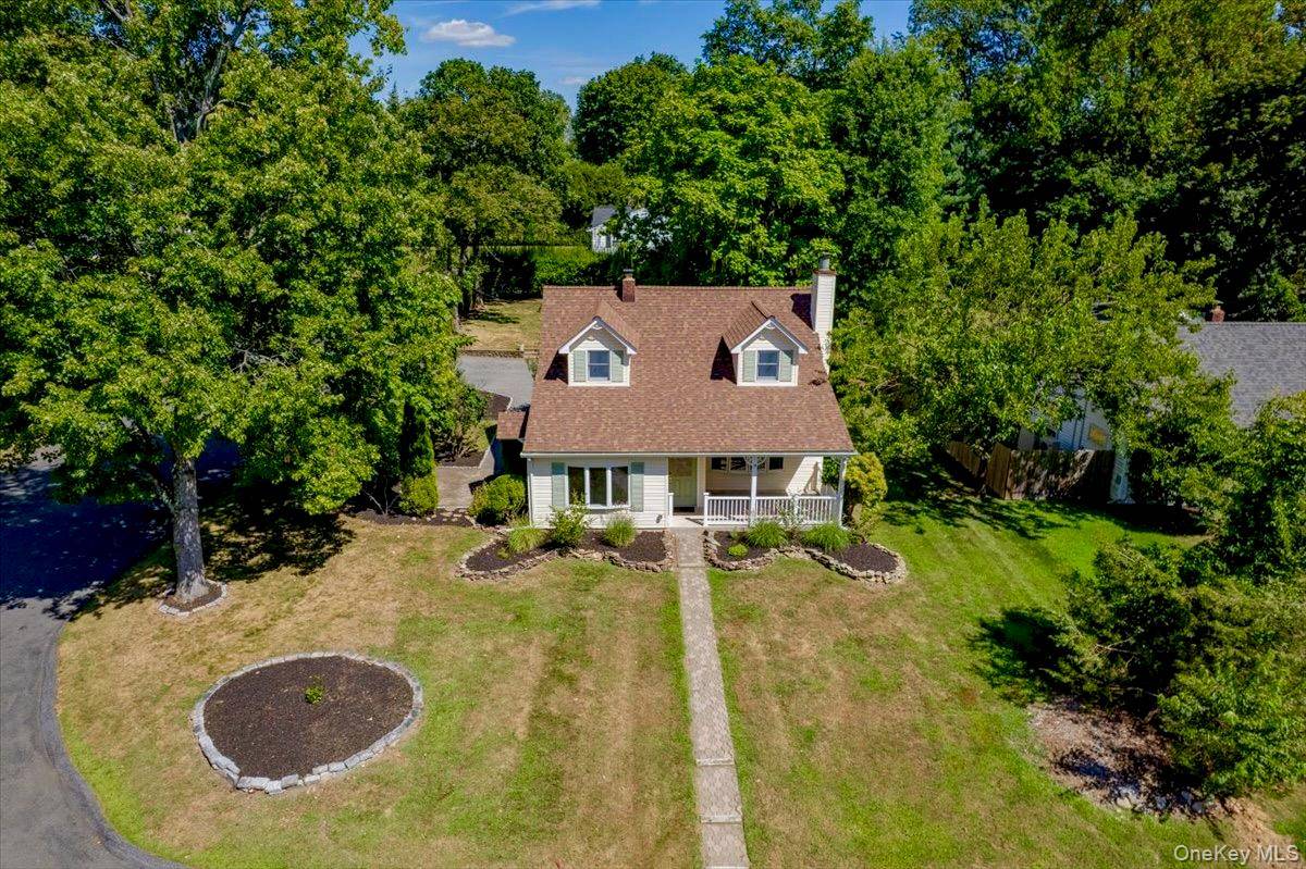 Step into this storybook Cape Cod filled with warmth, light and timeless charm.