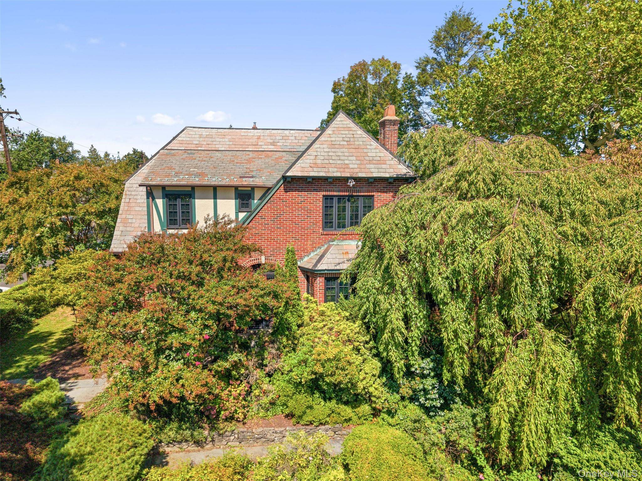 Welcome to 66 Rossmore Avenue a handsome English Tudor that blends architectural charm with modern comfort.