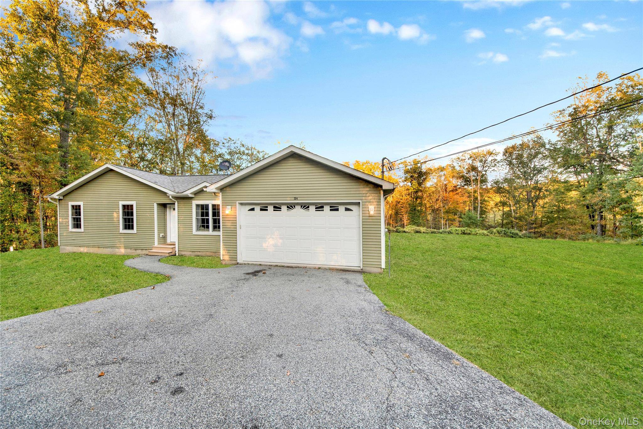 Welcome to 184 Penaluna Road, a serene ranch style retreat nestled on a stunning 5 acre wooded lot in Monroe, NY.