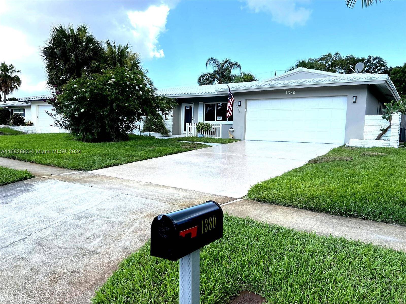 Beautifully renovated 2 bed, 2 bath home with impact windows doors, new flat roof, two car garage, backyard lights, and automatic sprinkler system.