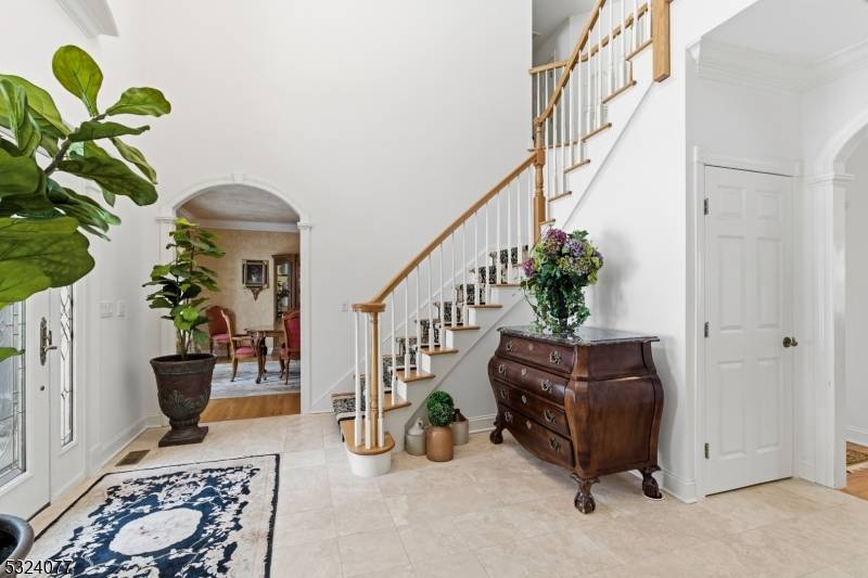 This gorgeous custom Colonial is situated on 6 plus acres with a private road in the gated Smoke Rise Club.