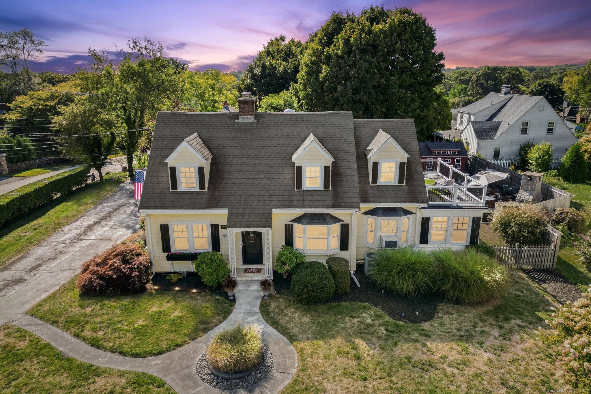 This beautifully remodeled 1928 yellow Cape Cod offers charm, comfort, and versatility.