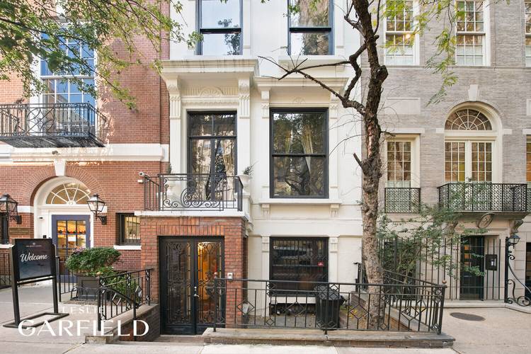 51 East 75th Street is a distinguished two family townhouse, currently configured as a lower triplex and an upper duplex.