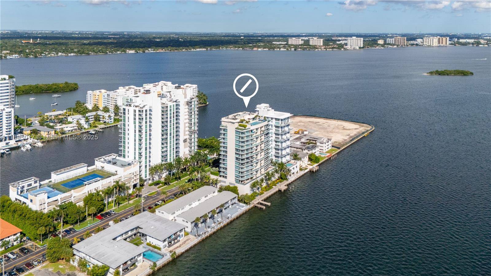 Experience luxury in this stunning 2 story flow through at Cielo on the Bay, a boutique building with only 36 units.