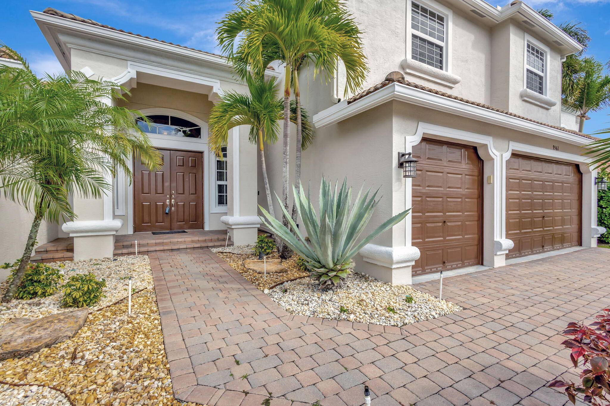 This stunning 5 bedroom, 4 bathroom home with an office features a luxurious primary suite on the main floor with a spacious bathroom, sitting area, and two walk in closets.