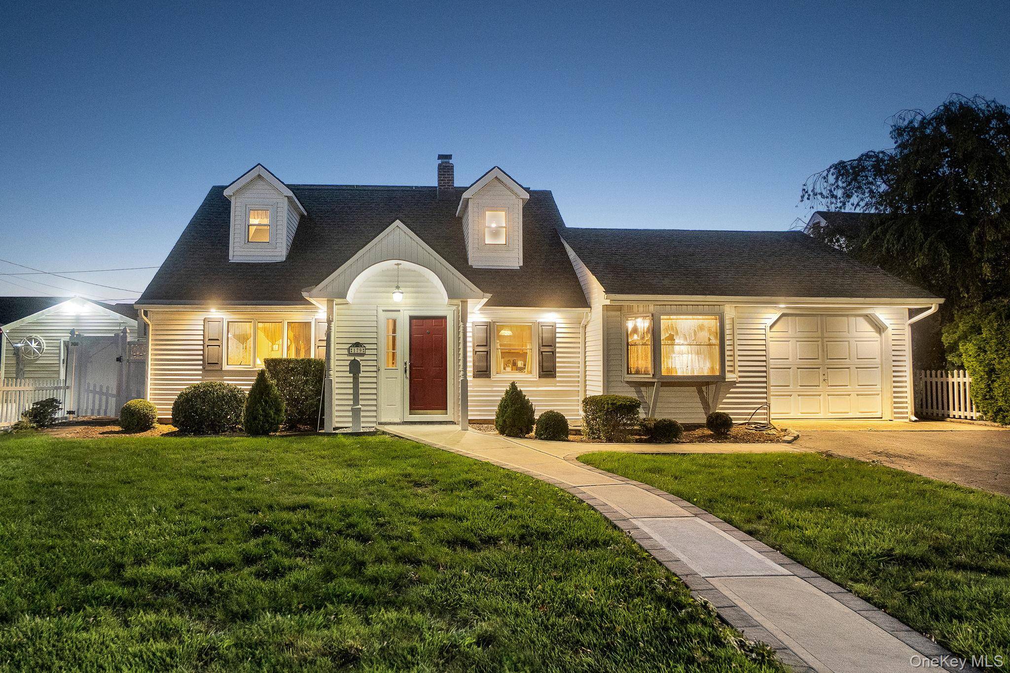 Welcome to this spacious and beautifully maintained 5 5 bedroom, three full bath Expanded Cape, perfectly situated on a picturesque block in Levittown !