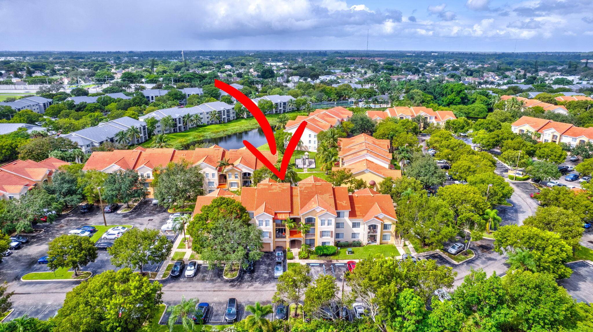 Fixer upper first floor condo located in the private gated community of Emerald Isle at Laguna Lakes in West Palm Beach.