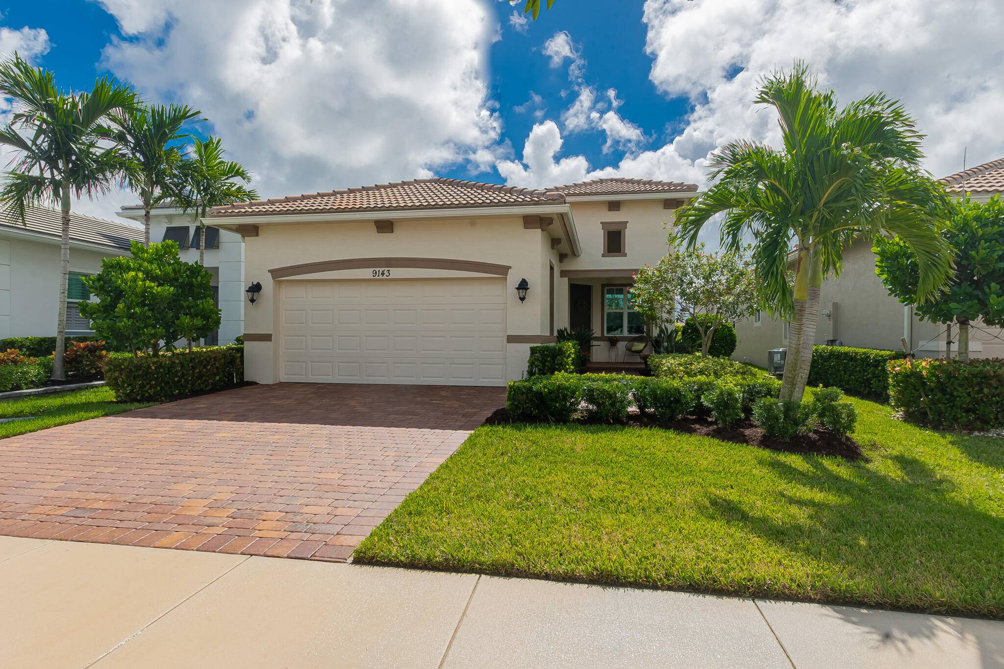 Cresswind at PGA Village Verano, this 2 2 2 with Den Office home offers a gorgeous lake view with a picture frame screen and paver patio to enjoy the views.