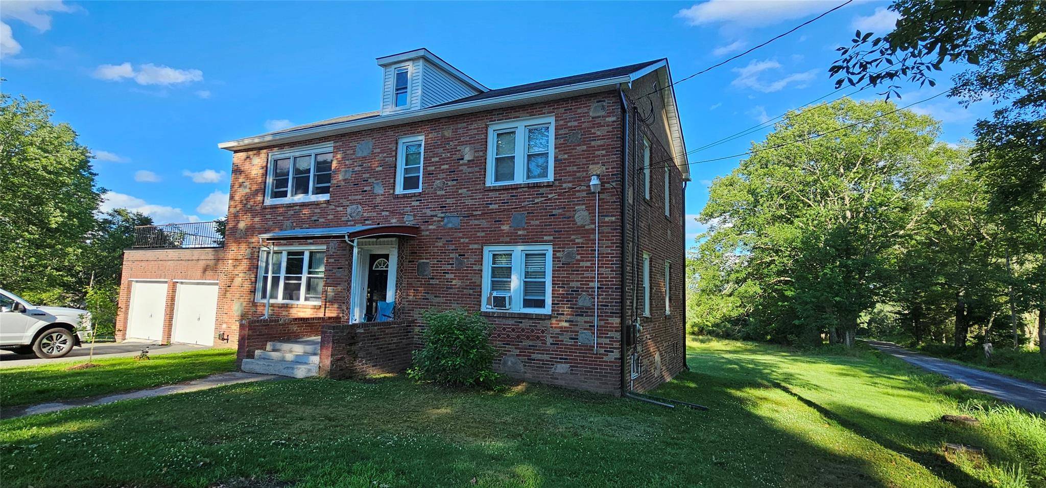 Country Duplex ! This 2 story brick home features a main level apartment that has recently been renovated and features a sunny living room, a dining area and open kitchen ...