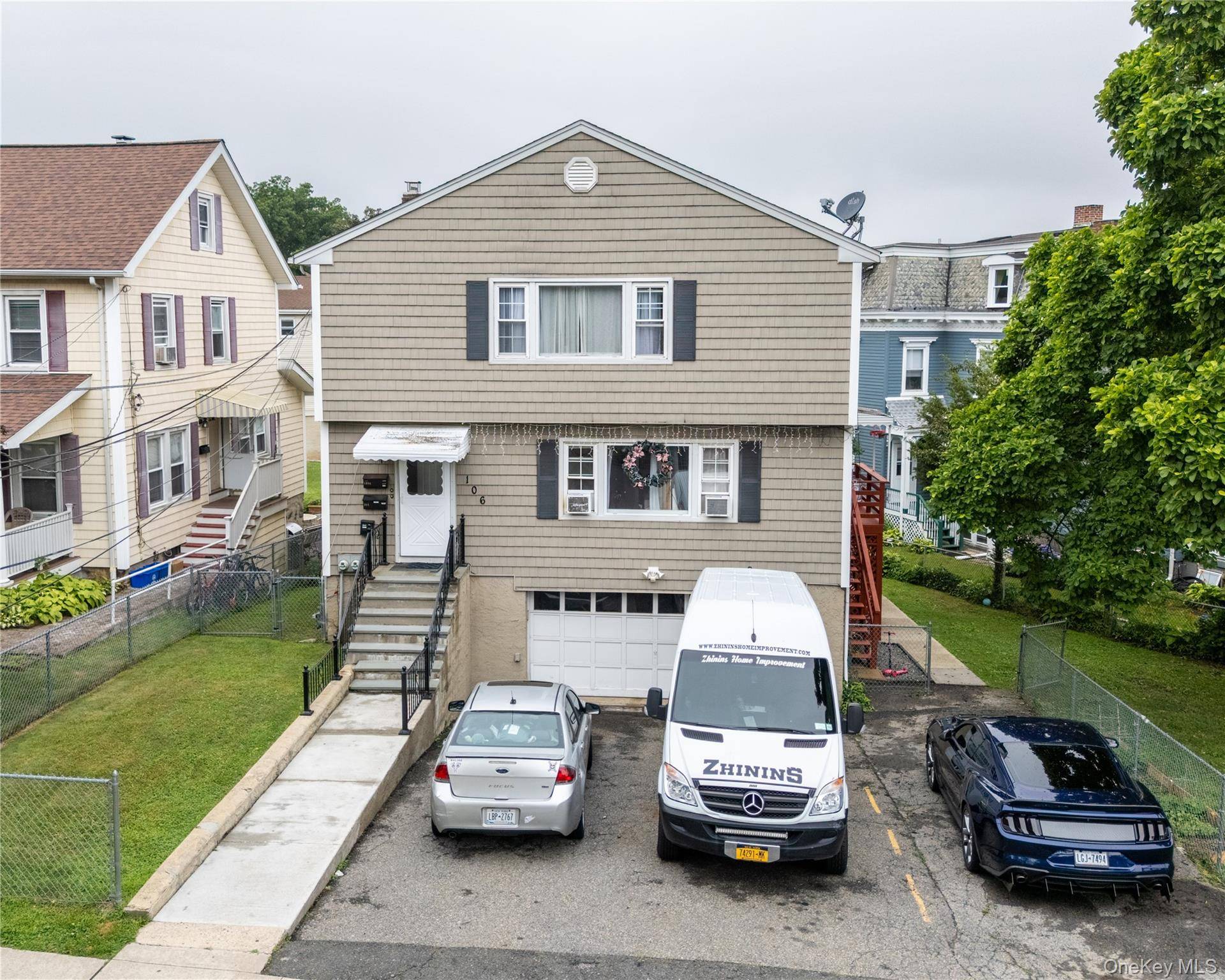 Well Maintained 2 Family with large level manicured lawn in rear and patio.