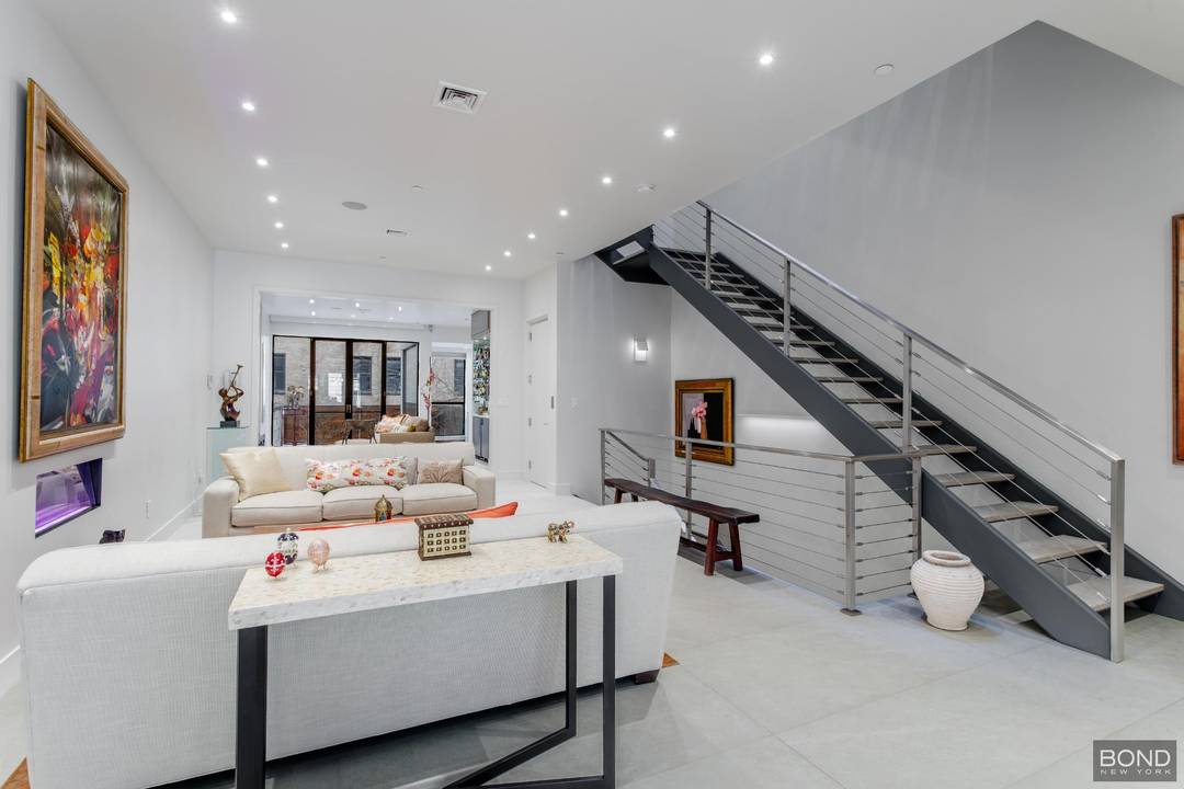 238 West 74th Street is an elegant Barrel Fronted Row House in the Neo Grec style with Romanesque influence, built in 1886 by William J Merrit.