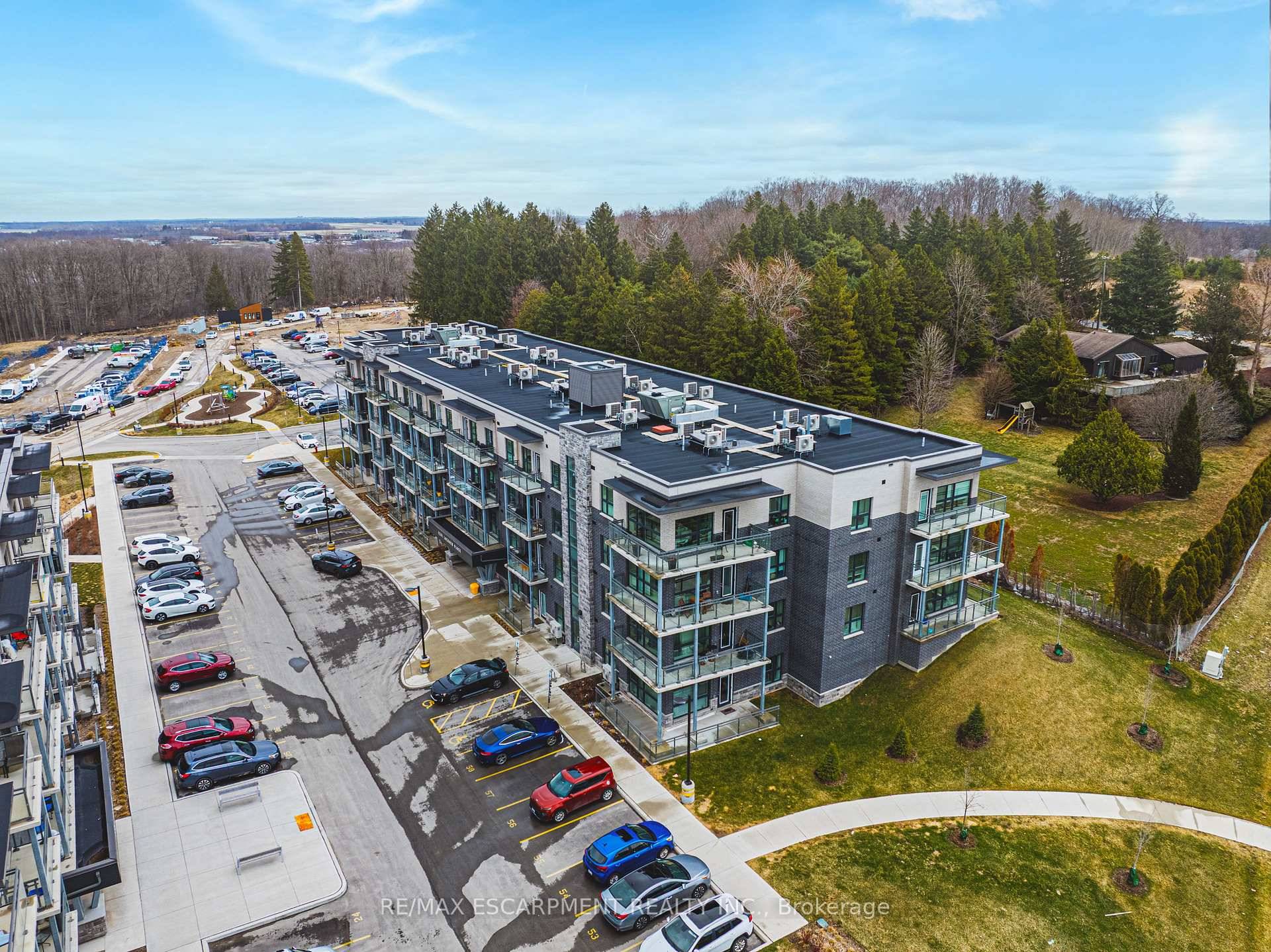 Premium 2 bedroom 2 bath condo in desirable Lackner Woods with private balcony overlooking evergreens.