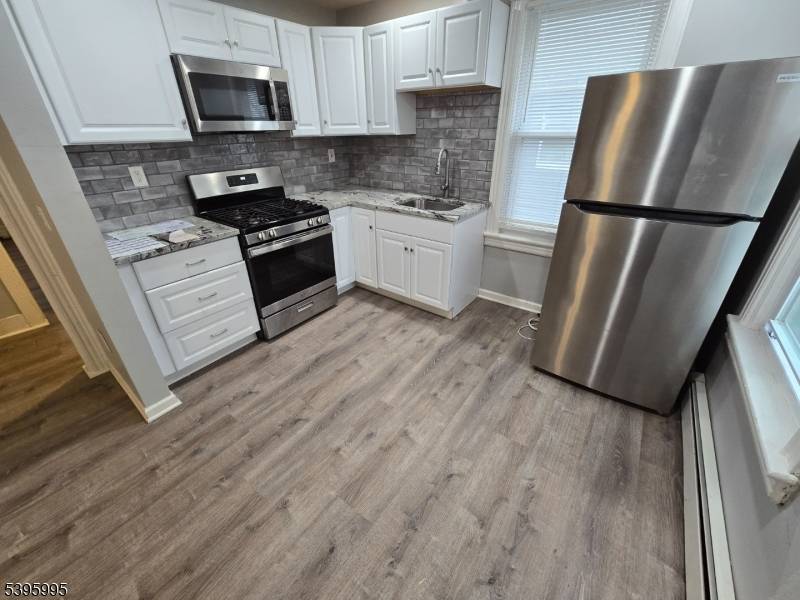 Exciting opportunity to own this legal 2 family home with a bonus unit, ideally located just steps from Bound Brook's vibrant downtown and train station !