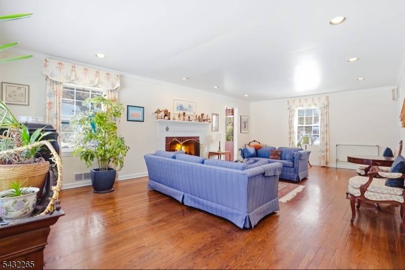 Located on a beautiful tree lined street in the prestigious historic Hartshorn district of Short Hills, this classic brick front Colonial combines timeless elegance with modern comfort.