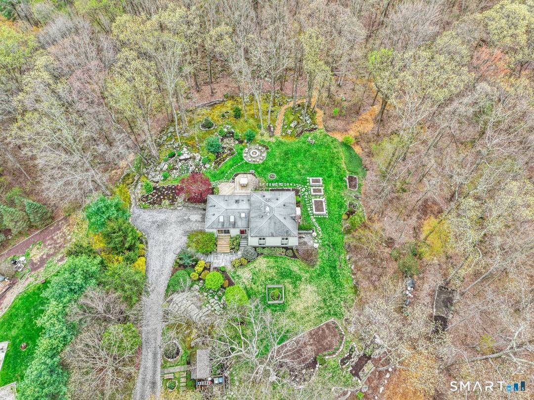 Set on a level 2 acre property, bordered by over 200 acres of protected nature preserve with scenic trails, this exceptional home offers a rare blend of privacy, convenience, and ...