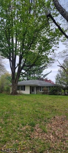 Main value in land. Oversize single family buildable lot.