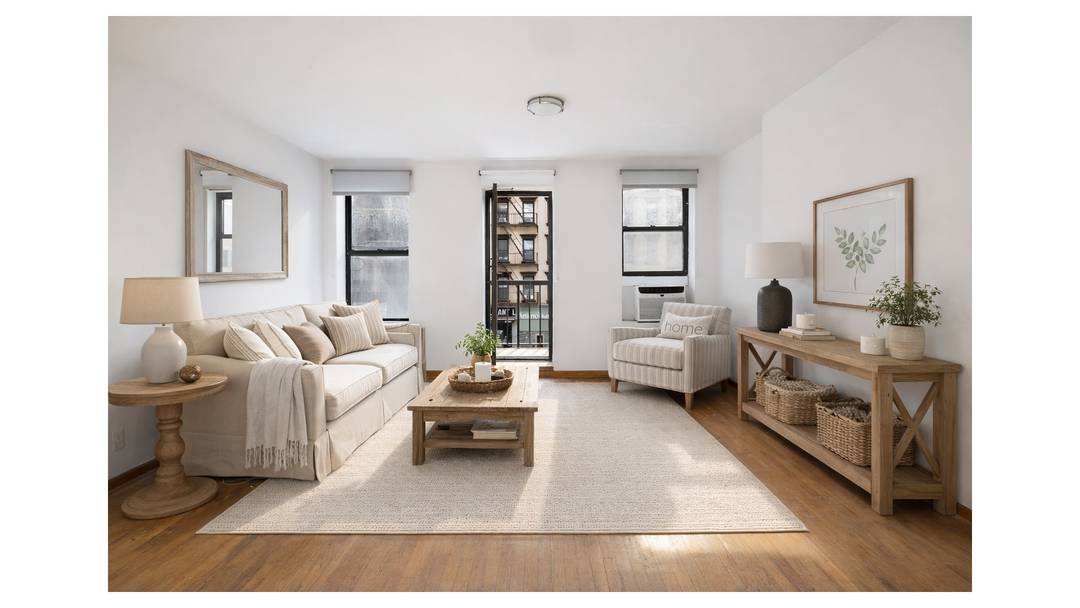 Spacious and full of light, this three bedroom triplex offers approximately 1, 800 square feet of flexible living across three levels.