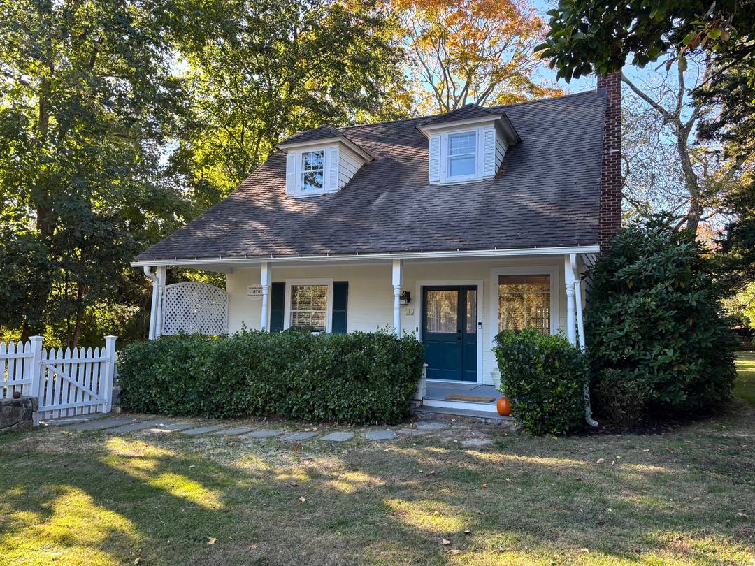 An inviting front porch welcomes you home to this light filled historic four bedroom cape within walking distance to the wonderful town of Westport.