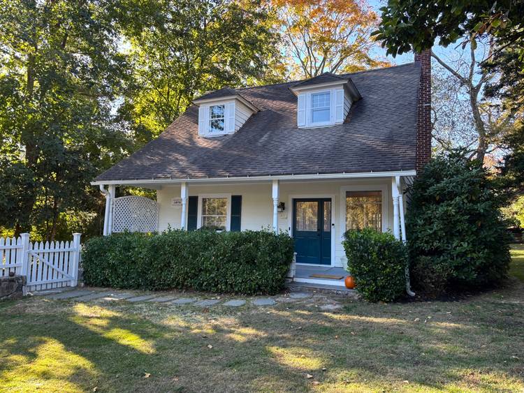 An inviting front porch welcomes you home to this light filled historic four bedroom cape within walking distance to the wonderful town of Westport.