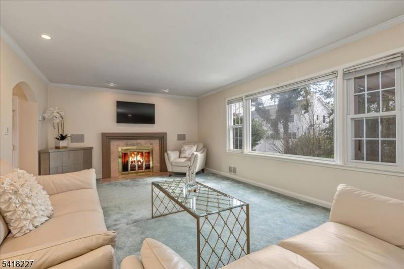 Beautifully maintained and thoughtfully updated, this 5 bedroom, 2.