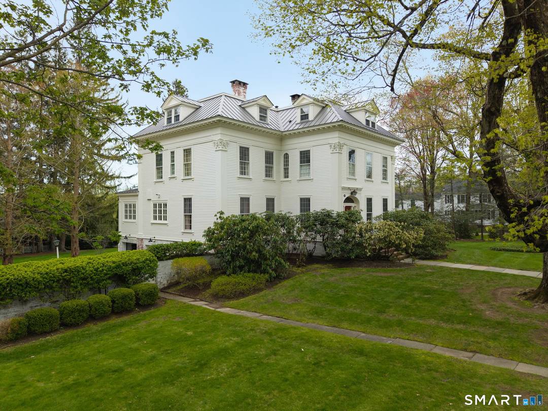 This stunning 1874 Federal house sits on a 3.