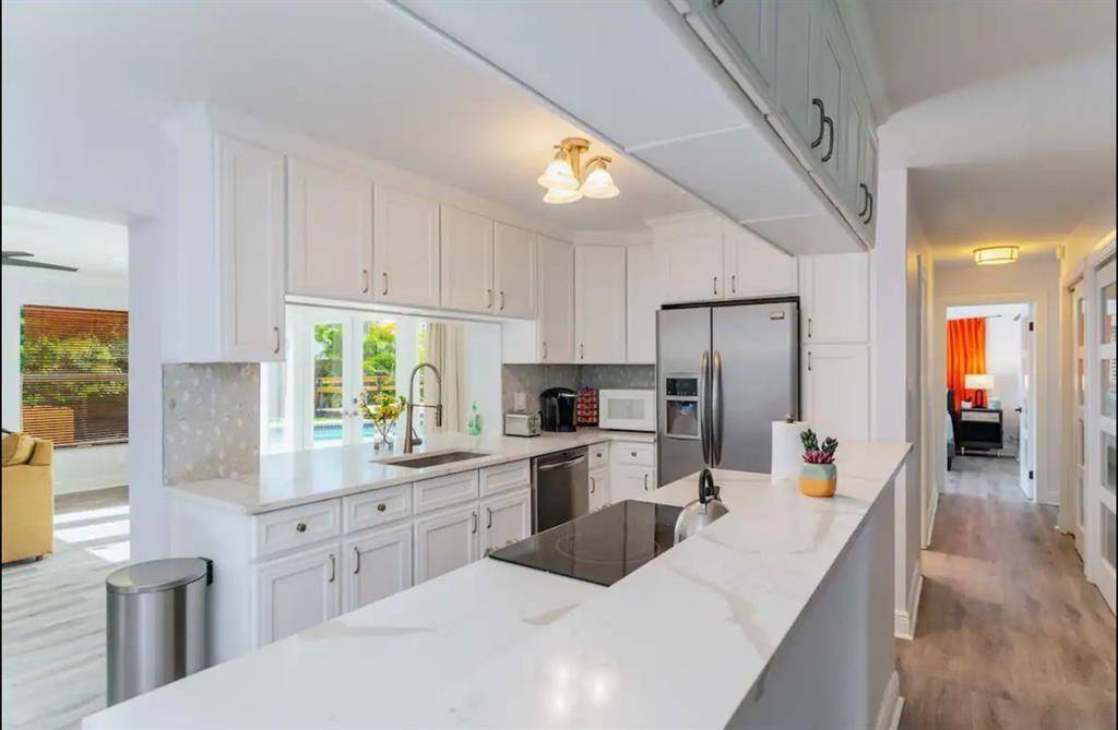 Welcome to this beautifully renovated 4 bedroom, 3 bathroom pool home in the heart of Lighthouse Point.