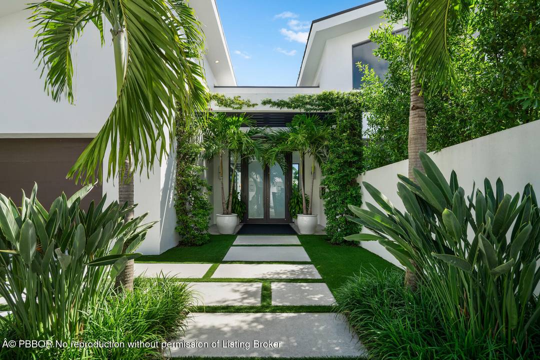 Set on a 9, 345 square foot lot, this SoSo residence combines privacy, thoughtful design, and a prime location near the Intracoastal bike path and Palm Beach Island.