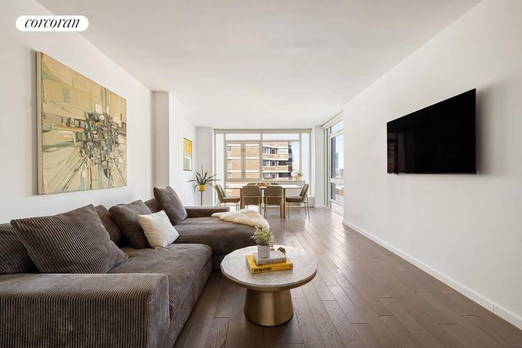 Enjoy exceptional natural light from oversized windows in this river facing corner two bedroom, two bathroom condominium home, where serene water views and vibrant city energy define the living experience.