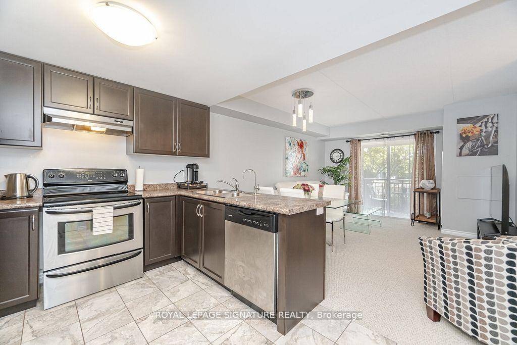 Welcome to 67 Kingsbury Square Unit 111 a bright and spacious 2 bedroom den condo in Guelphs highly desirable Pineridge Westminster Woods community !