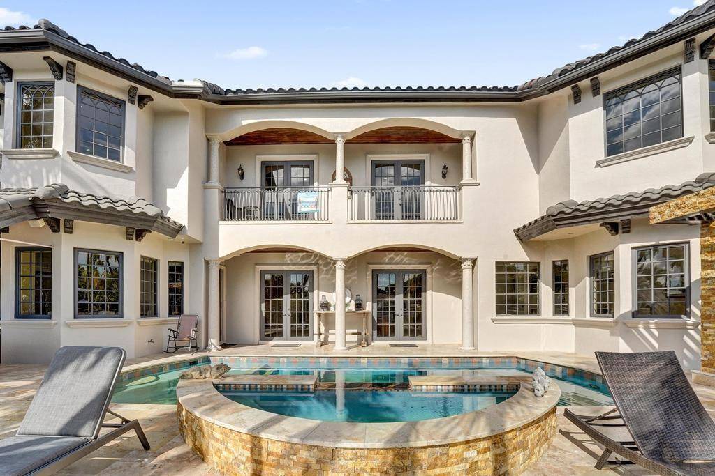 Welcome to this spectacular deep water estate in Lighthouse Point, FL, where luxury meets tranquility on the Alamada waterway.