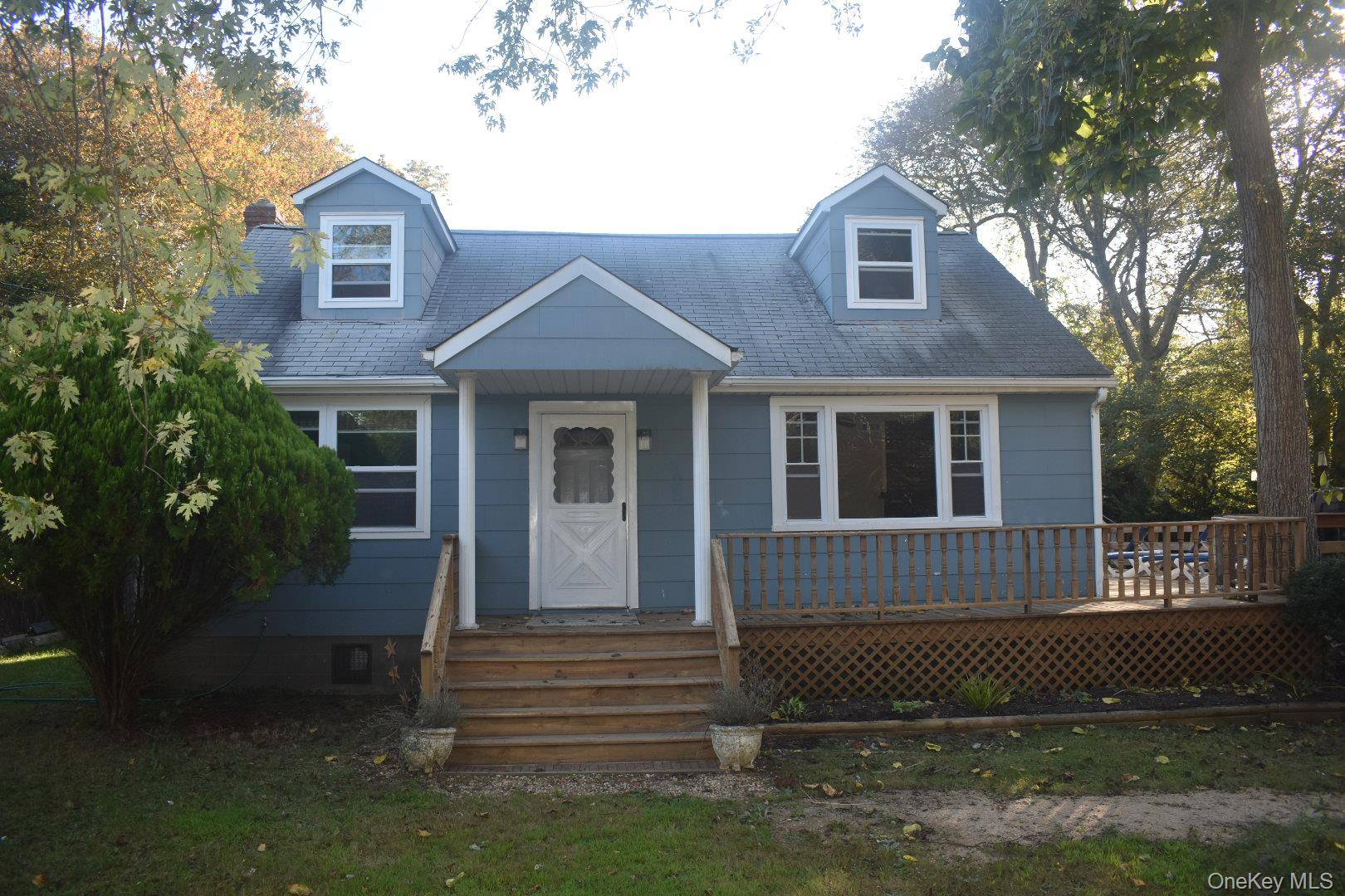 Bright and updated 4 bedroom Cape located just minutes from Smith Point County Park, Fire Island Beaches and close to Narrow Bay.