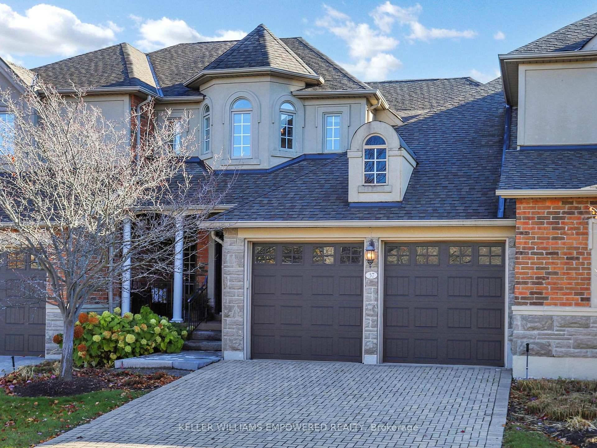 Tucked away in a gated community backing onto serene, forested views !