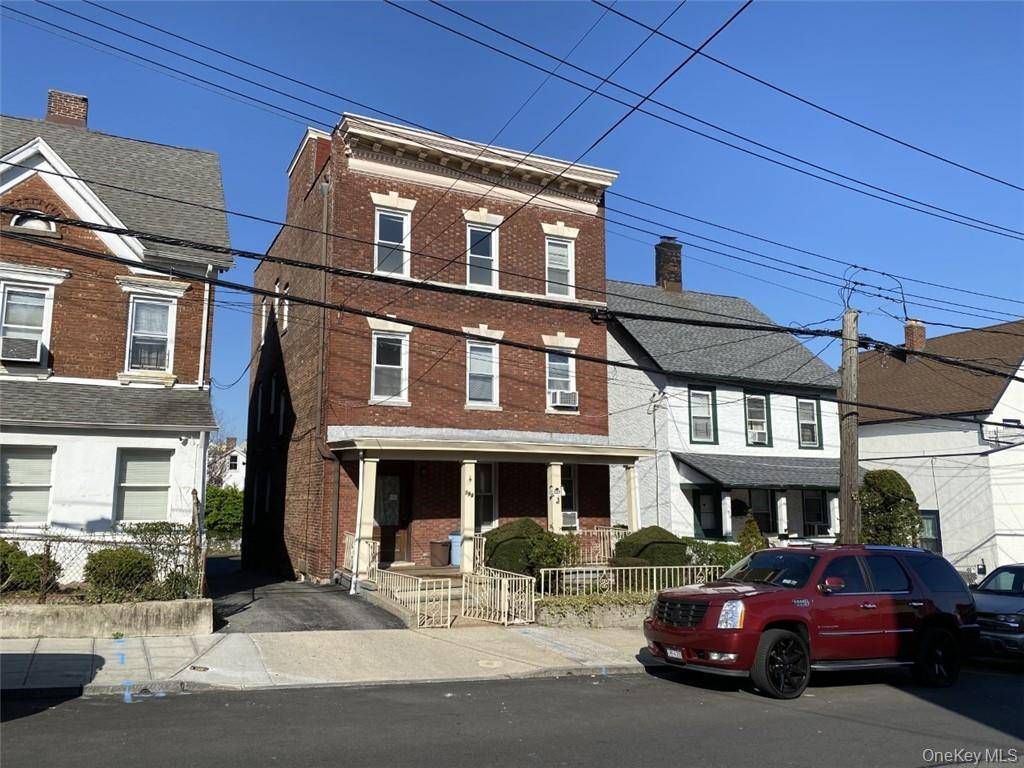 Three family brick home in the heart of the west end of New Rochelle.