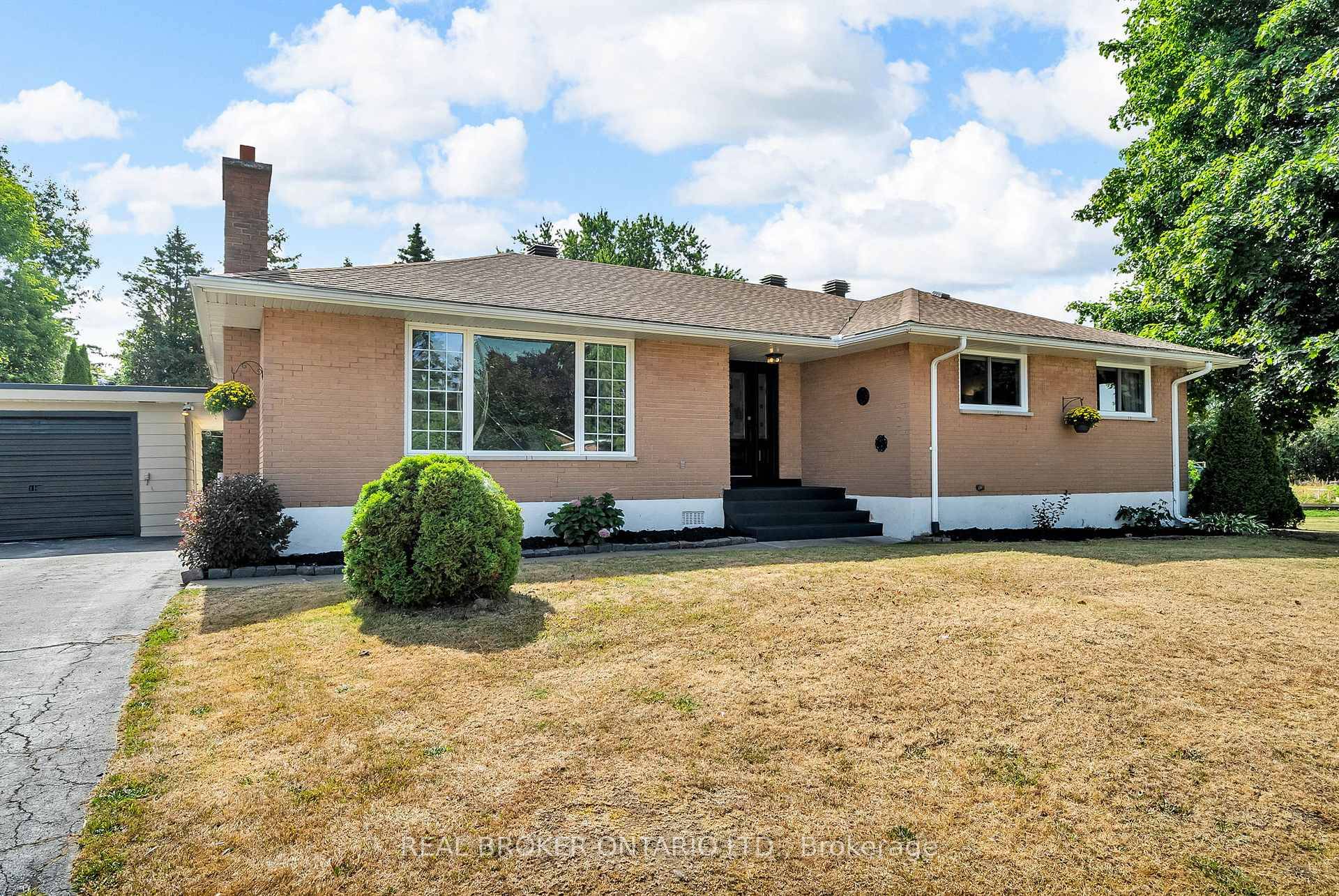 Immaculate 3 Bedroom Brick Bungalow home with Detached Garage amp ; Modern Upgrades.
