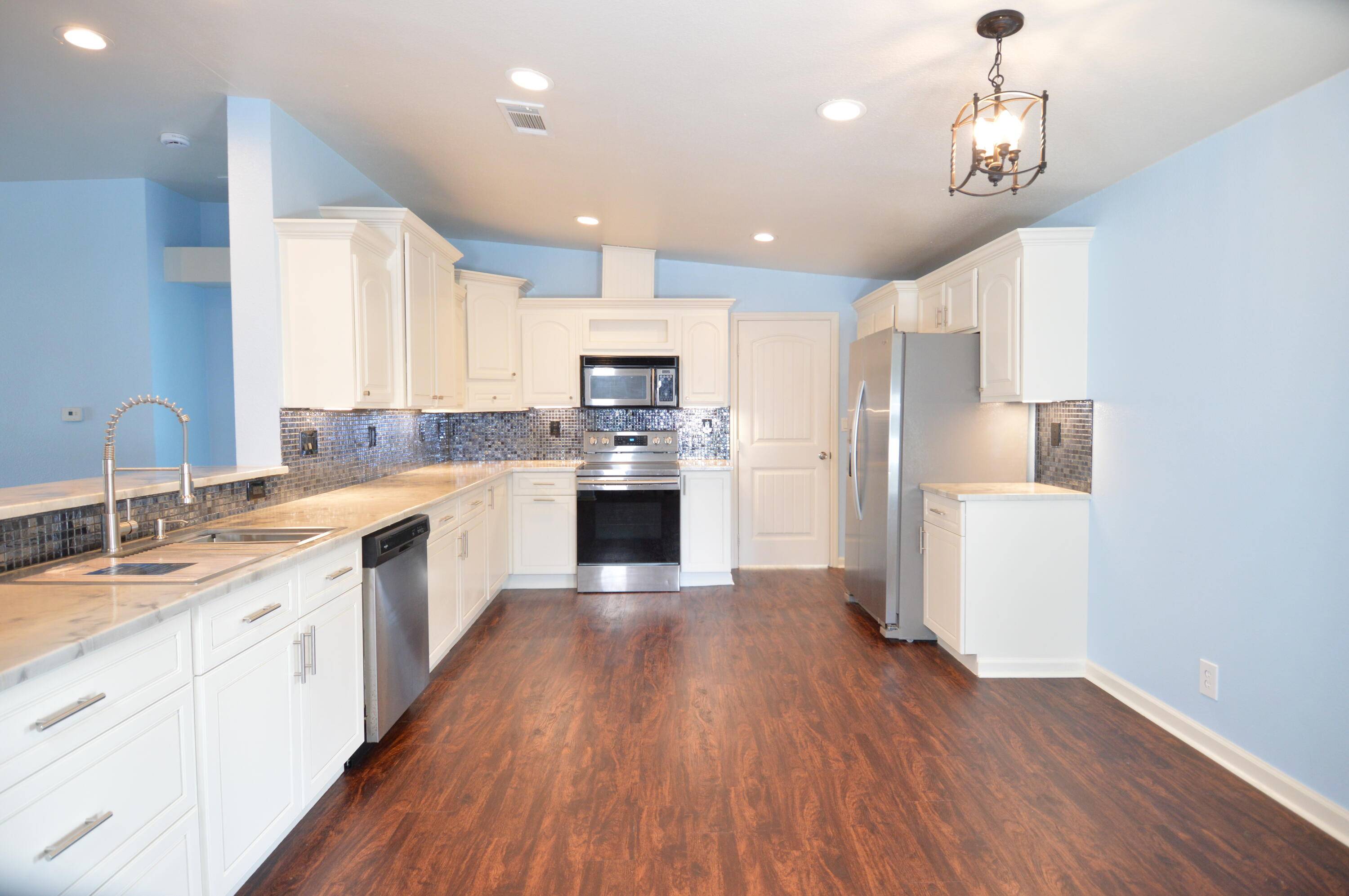 Gorgeously updated 3 bed, 2 bath, plus bonus room on a spacious corner lot just under 1 4 acre !