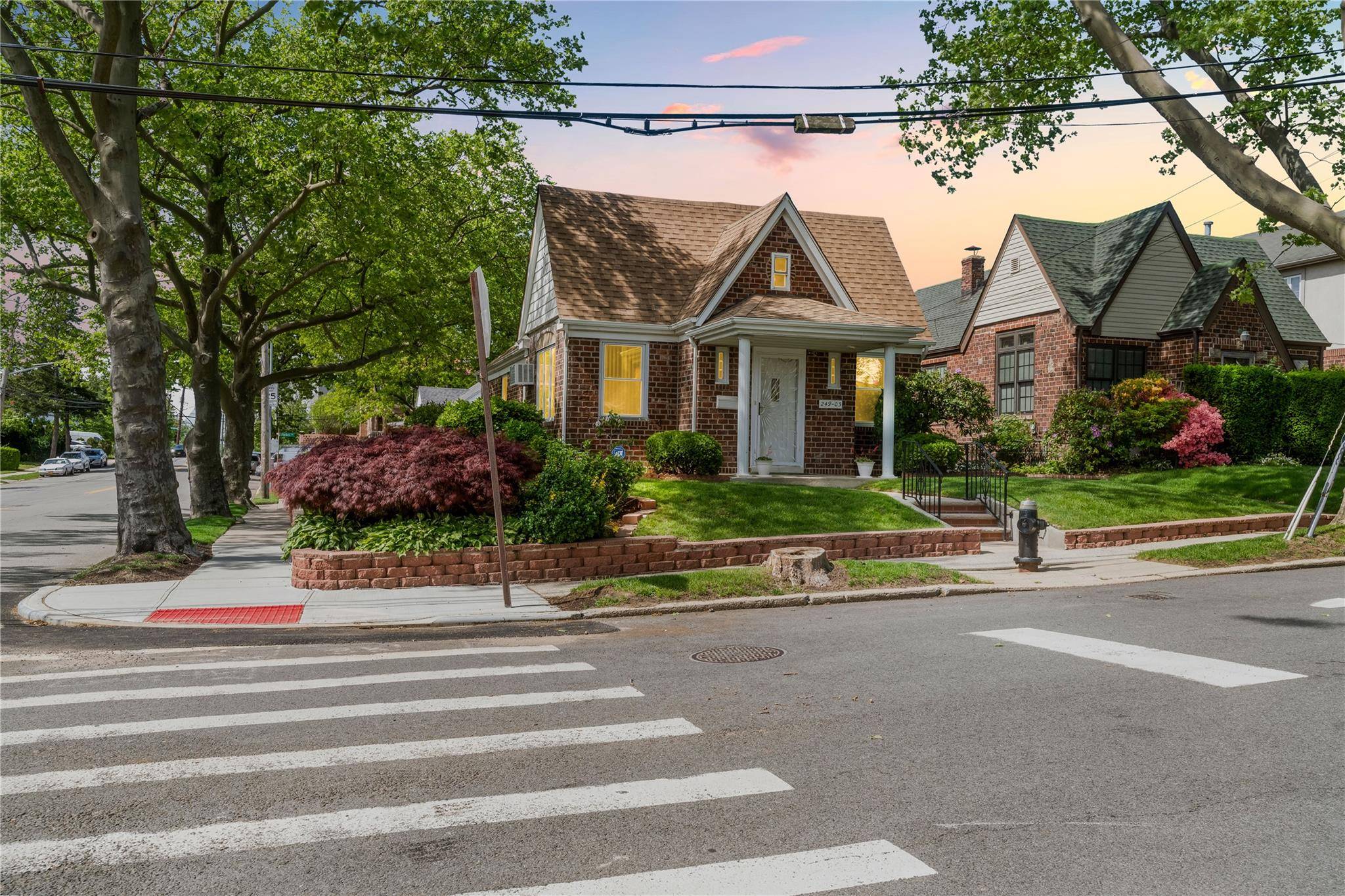 Discover this beautifully maintained corner property, ideally situated in the desirable heart of Little Neck, offering an unparalleled blend of suburban tranquility and urban accessibility.