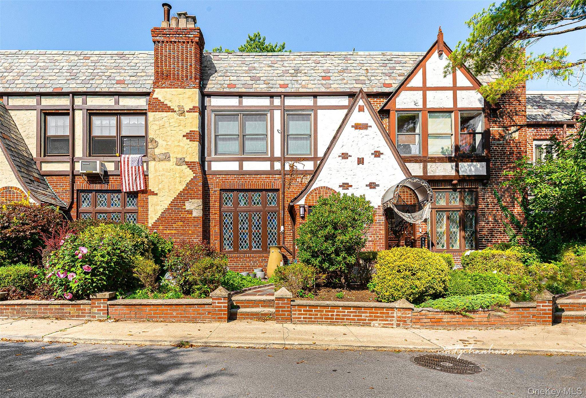 Step into timeless elegance with this masterfully designed Tudor home by the renowned Wolosoff Brothers where old world craftsmanship meets modern sophistication.